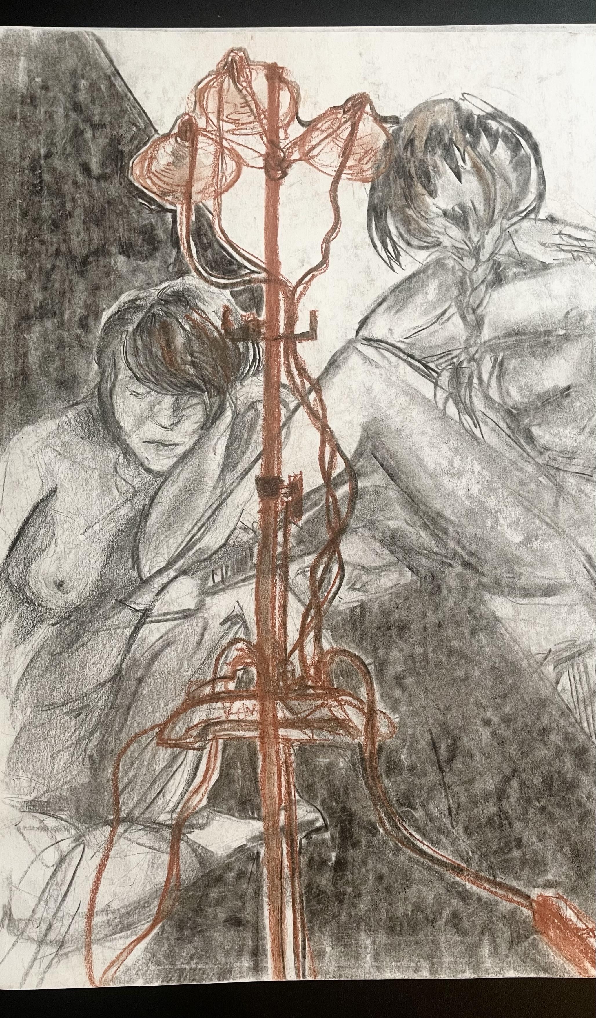 charcoal drawings of a nude model with a conté drawing of some clamp lights in the foreground